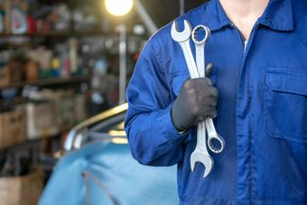 Hands Of Car Mechanic — Keewatin, MN — Olson's Body Shop & Salvage, Inc.