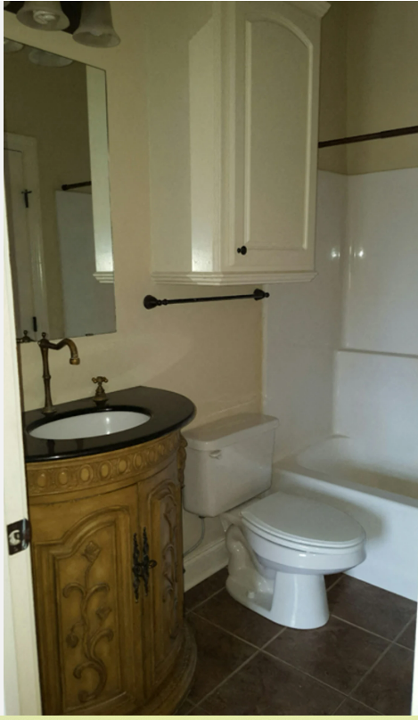A bathroom with a sink , toilet and bathtub