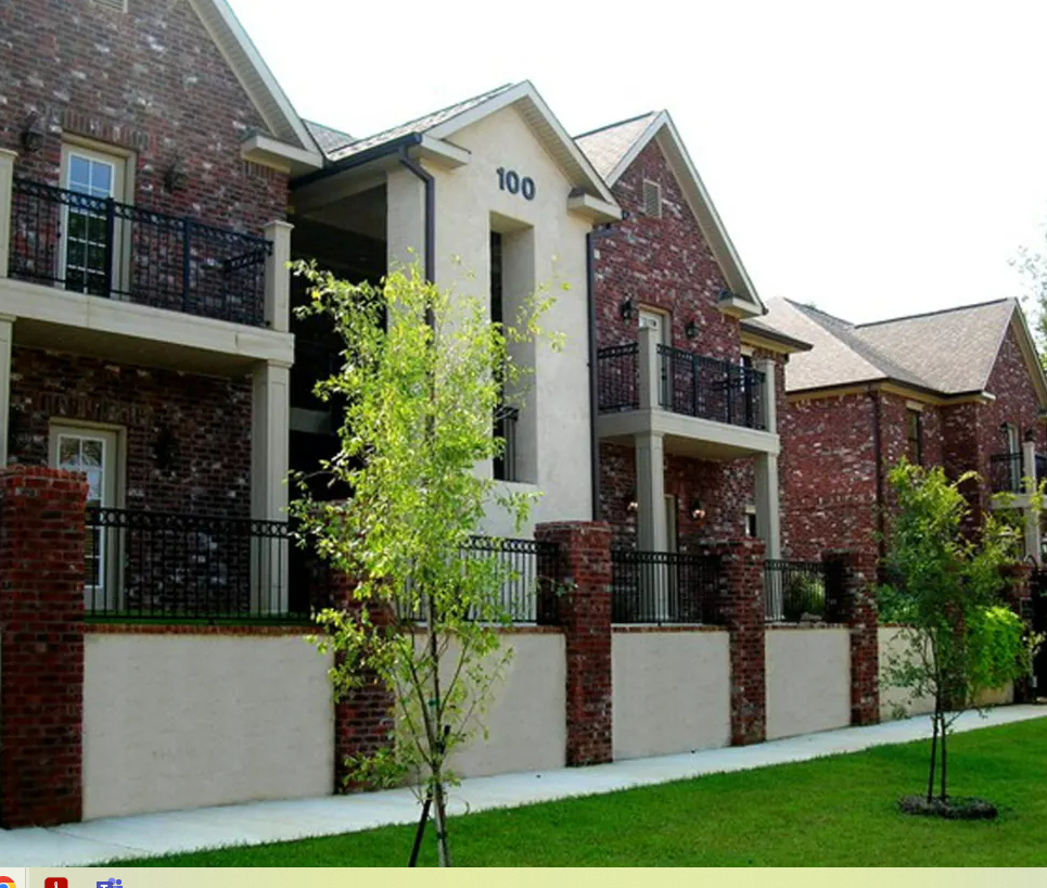 A brick building with the number 100 on it