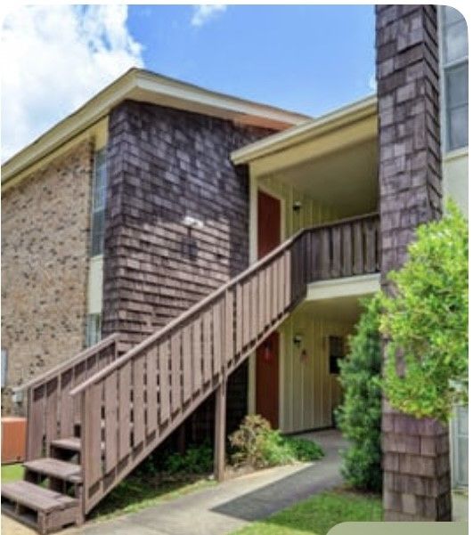 A house with stairs leading up to the second floor