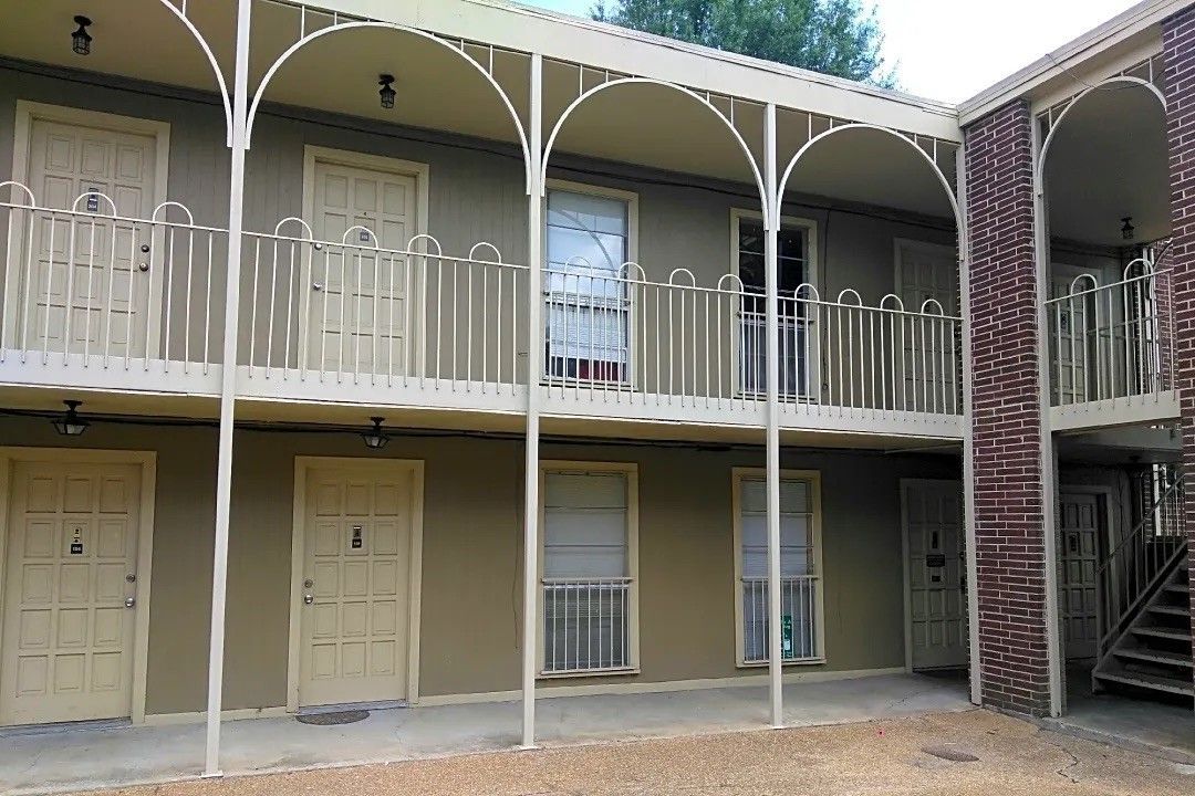 A building with a lot of doors and balconies