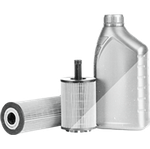 Silver car oil filter and bottle of motor oil on a white background | Automotive Physicians