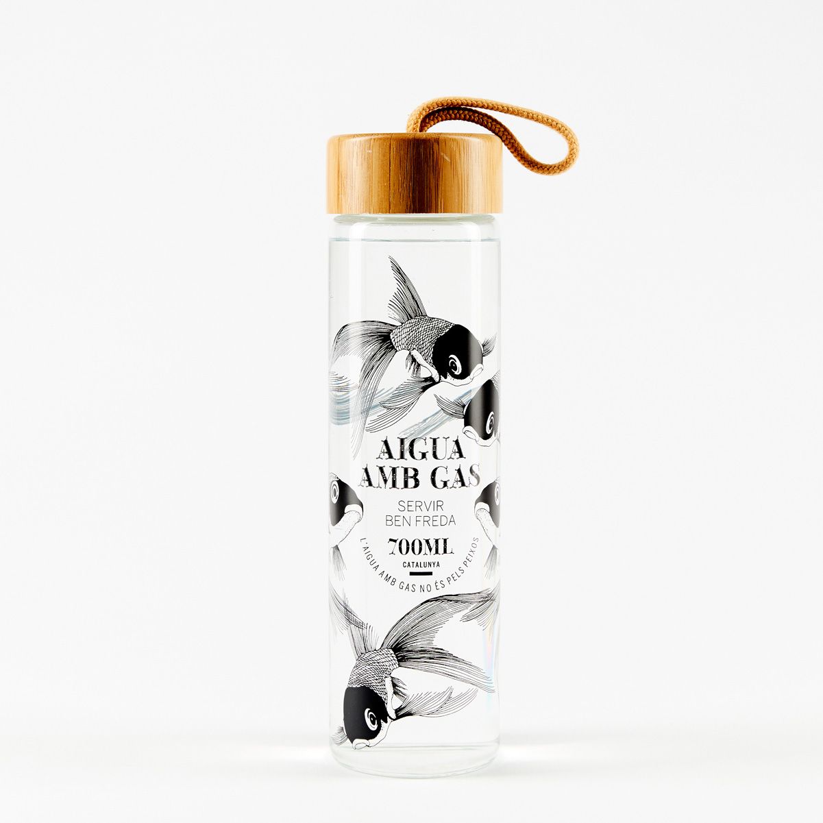 Clear glass bottle with black floral label, bamboo cap, and looped cord on a white background