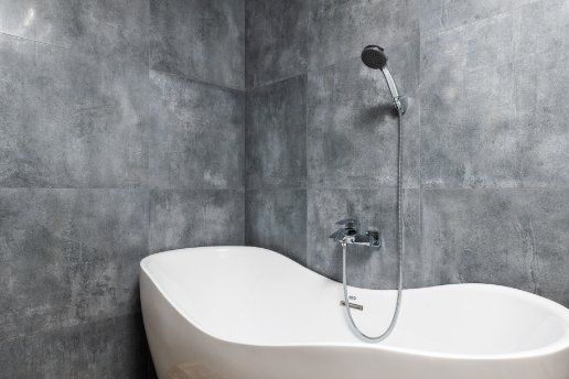 A newly remodelled bathroom space with an elegant looking freestanding bathtub. Bathtub installation by the expert renovators in Wollongong NSW.