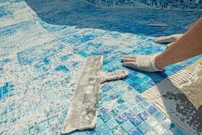 ground pool tiles laying by a contractor