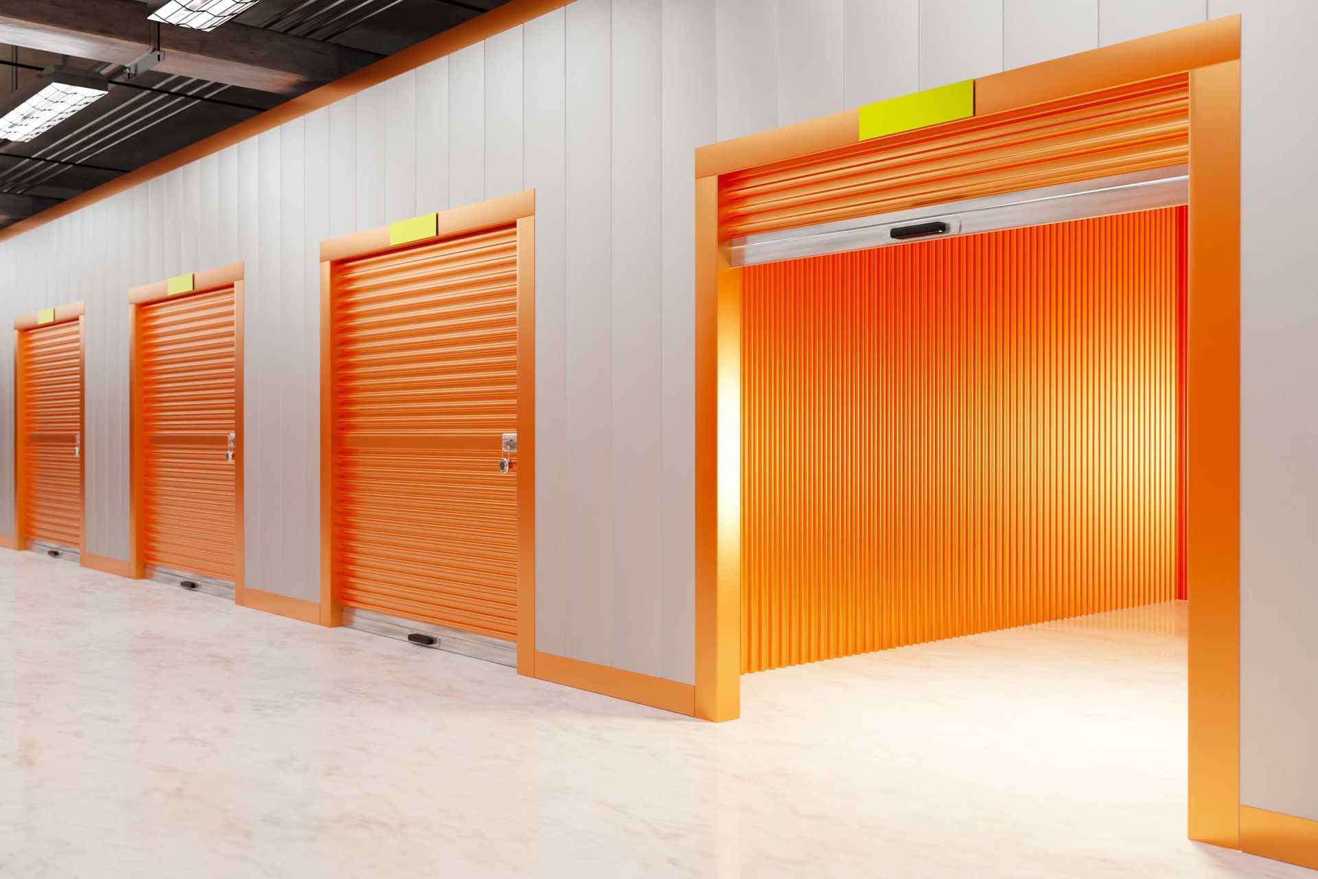 Mini storage unit with orange roll-up door inside self-storage facility.