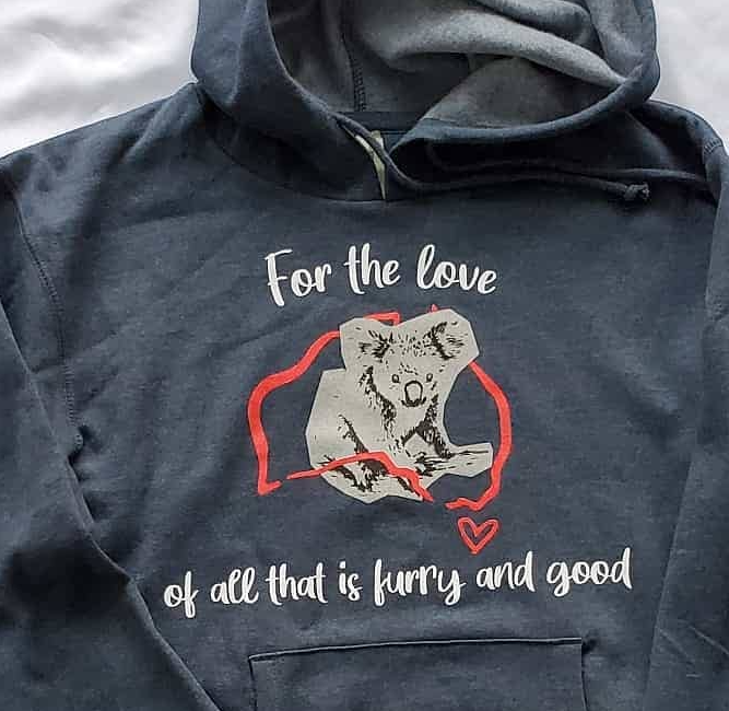 Dark hoodie with a dog graphic and the text “For the love of all that is furry and good”