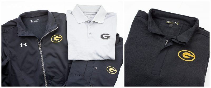 Black and white polo shirts and hoodies with a gold “G” logo displayed side by side