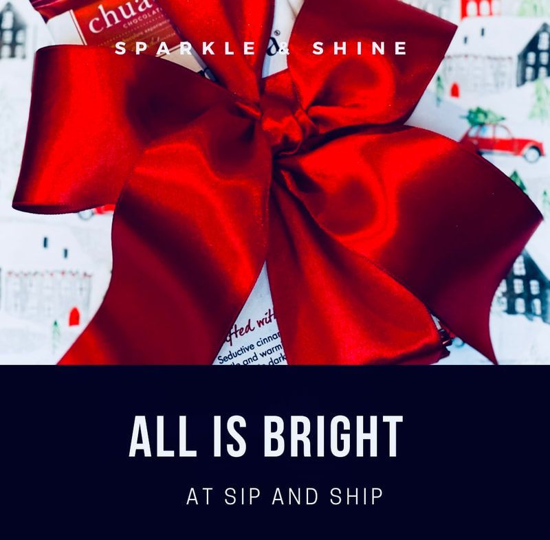 Gift with red bow and the words “All Is Bright” and “Sparkler Shine” on a holiday-themed background