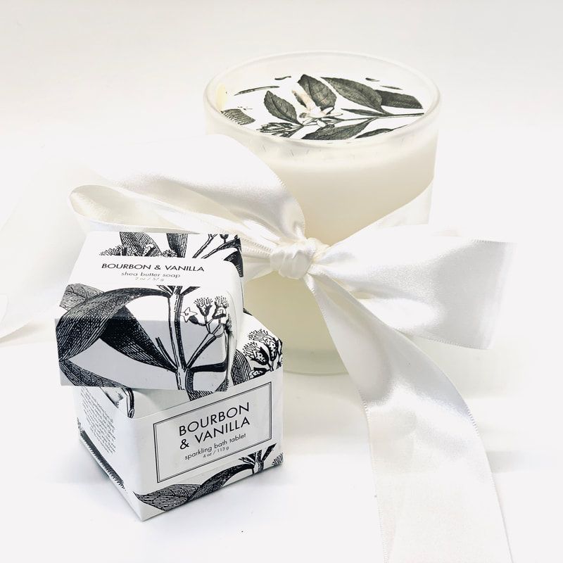 White gift box and creamy dessert cup with ribbon on a white background