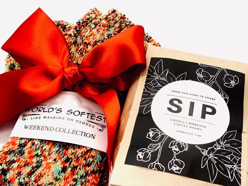 Gift set with a red bow and patterned items labeled “SIP” and “World’s Softest”