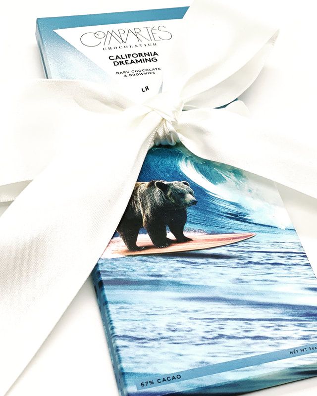 Turquoise California Bear Towel with a white ribbon bow, featuring a bear on a surfboard by the ocean