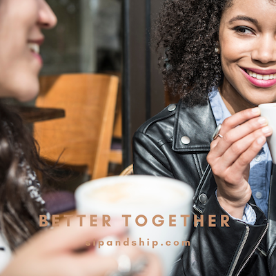 Two friends smiling with coffee in a cozy cafe, with “BETTER TOGETHER” text overlay.