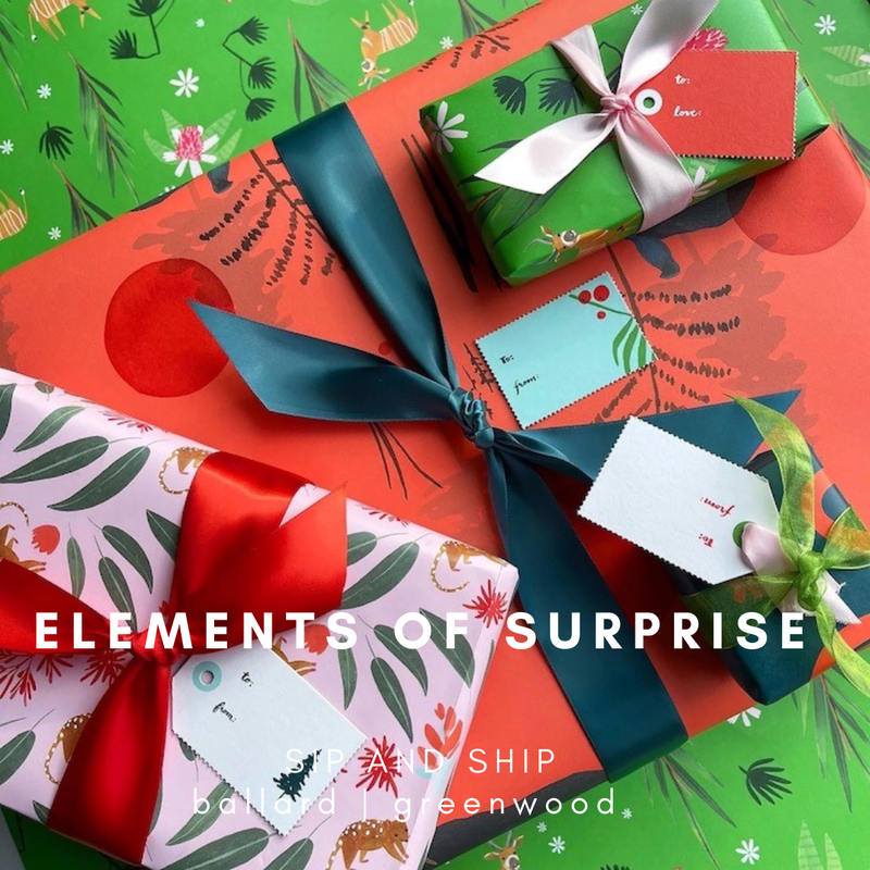 Festive red and green holiday gift boxes with ribbons and wrapping paper on a patterned background