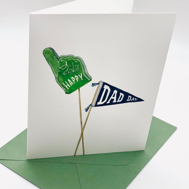 Green foam finger and blue “Dad” pennant on a white pop-up card with a green base.