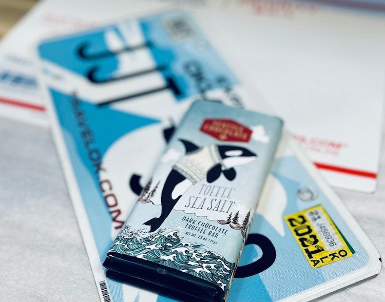 Travel brochures and a ski resort guide stacked on a table, with blue and white covers.