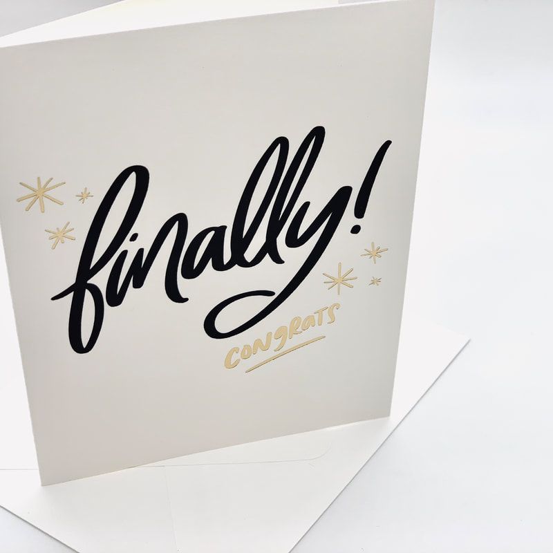 “Finally! Congrats” card with black script and gold accents on a white background