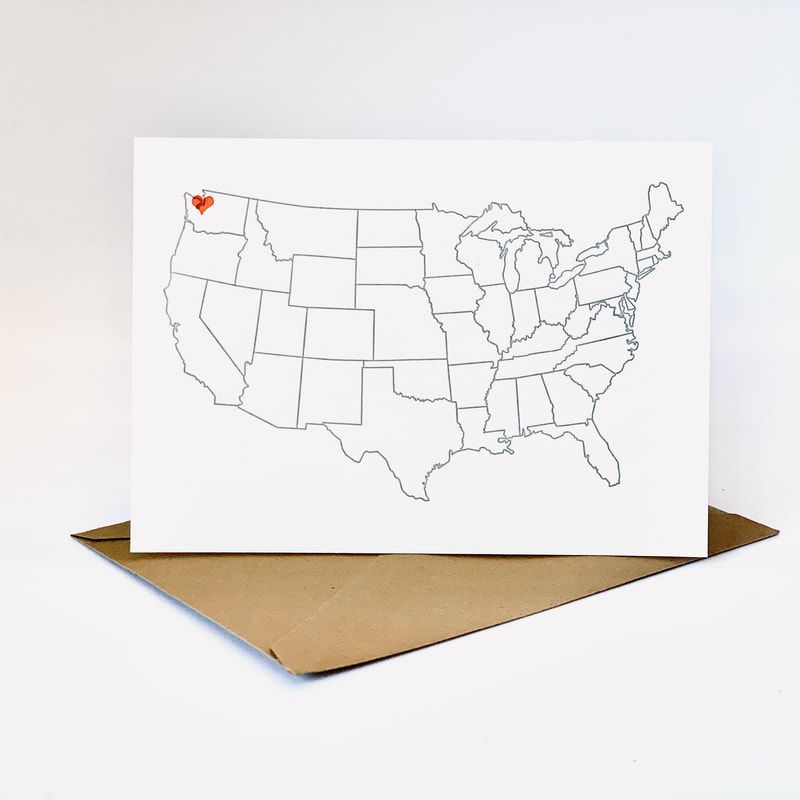 White U.S. map on a white card, with Oregon marked by a small red heart