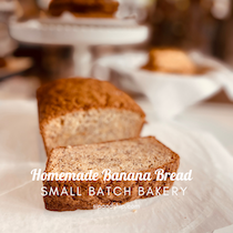 Sliced homemade banana bread on a plate with the words “Homemade Banana Bread” and “Small Batch Bakery”
