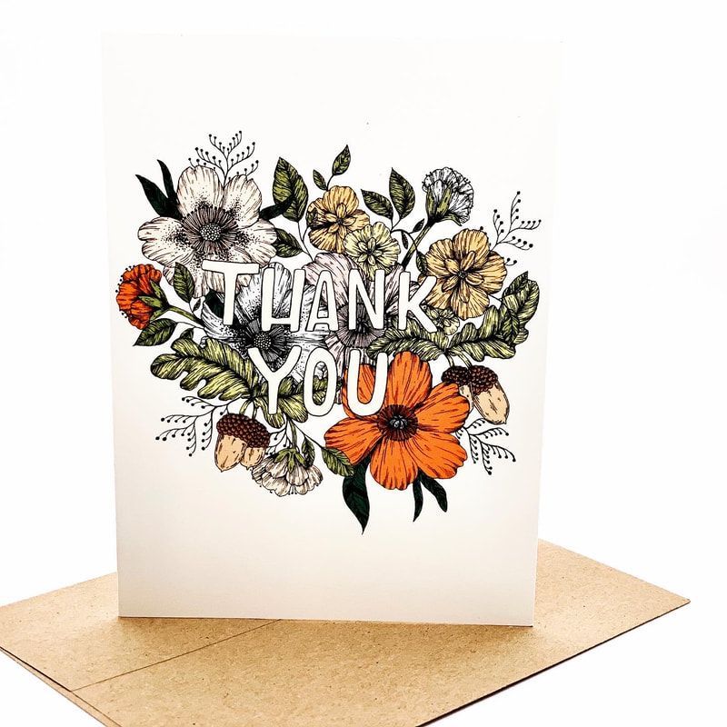 Floral thank you card with orange, yellow, and black flowers on a beige envelope
