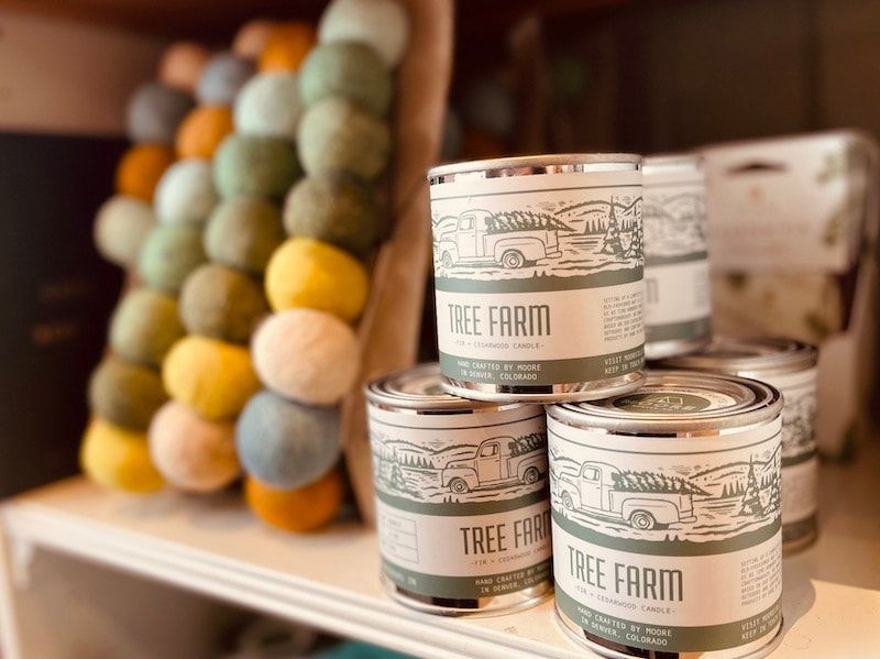 Stacked Bee Farm honey jars beside a honeycomb-pattern display