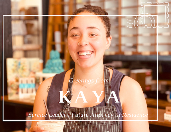 Smiling café worker behind the counter with text overlay reading “Greeting from KAYA”