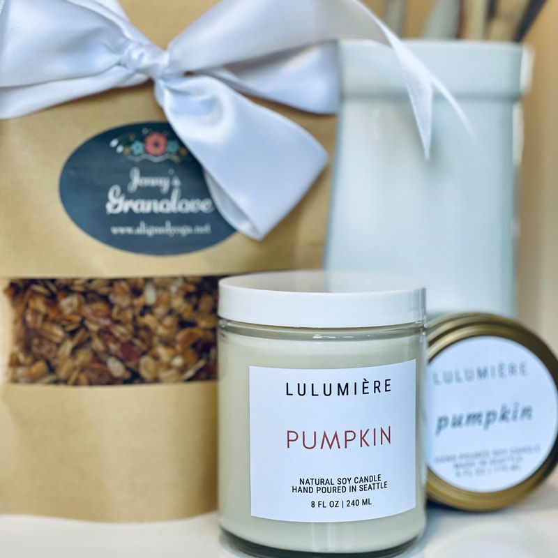 Lulumière pumpkin candle and matching jar with gift bag tied in white ribbon