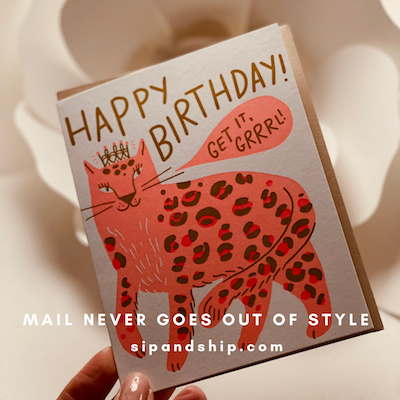 Funny birthday card with a red spotted cat and “Happy Birthday! Get it? Grrr!” text