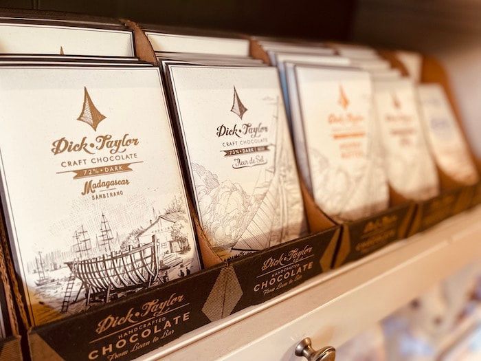Row of Dick Taylor craft chocolate bars displayed on a store shelf