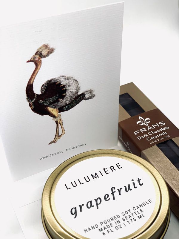 Fragrances and scent products with an ostrich illustration on a white card and a round grapefruit label