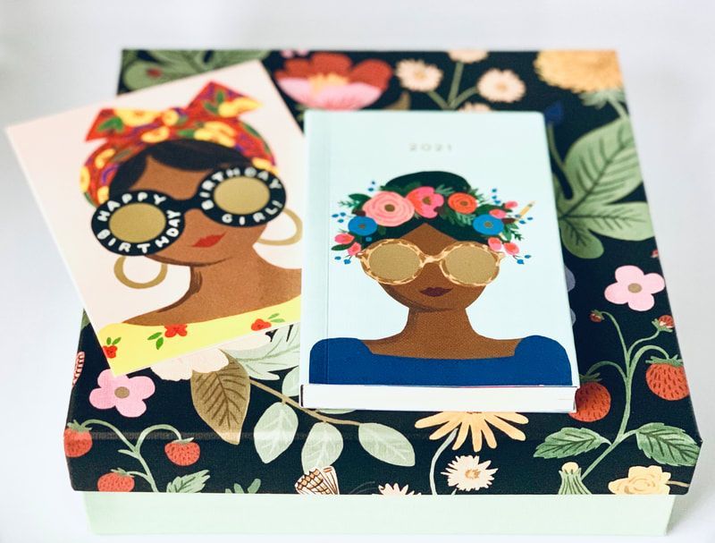 Two floral portrait cards on a dark botanical box