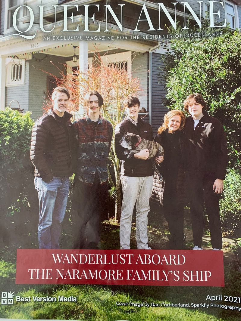 Five people standing in front of a house, with “Queen Anne” and “Wanderlust aboard the Maramor family’s ship” text.