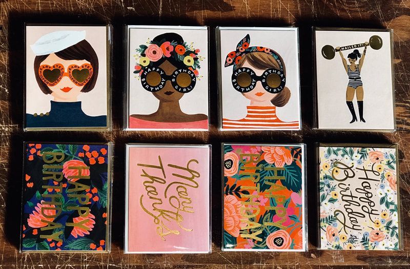 Eight colorful framed portraits and abstract art prints arranged in a 2x4 grid.