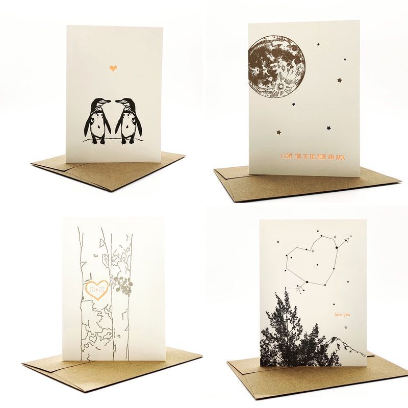 Four minimalist greeting cards on kraft paper bases, each with simple black line art and star-like accents.