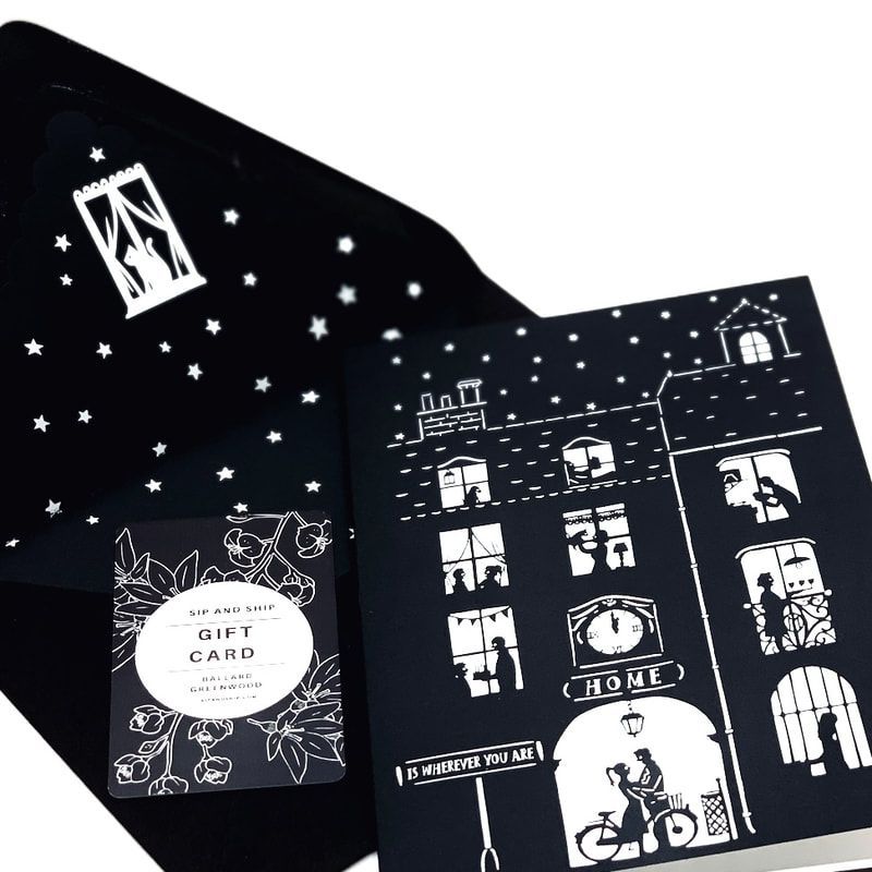 Black fold-out card with white line art of stars, windows, and buildings around a central 