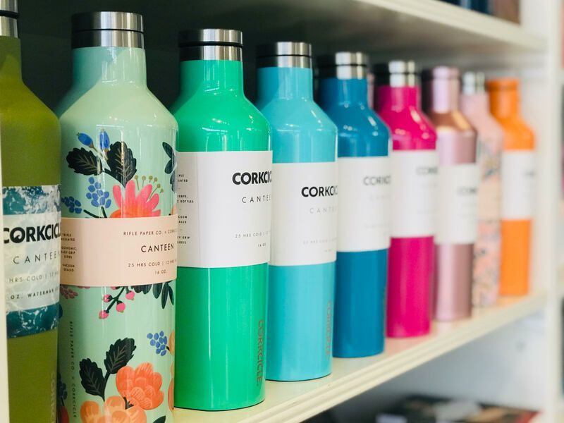 Colorful bottles of hair care products lined up on a store shelf