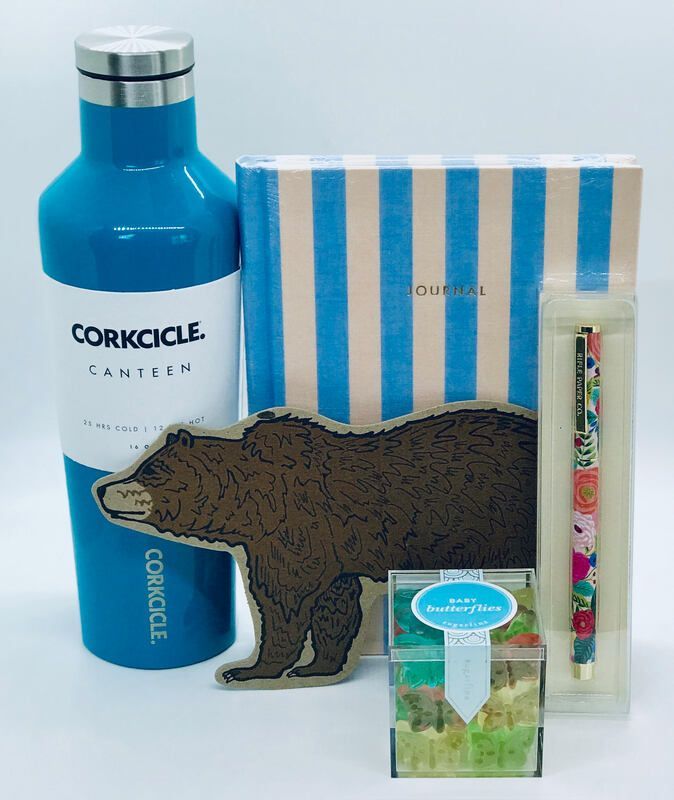 Blue Corkcicle bottle with striped gift box, bear-shaped wood cutout, and small floral stationery items.