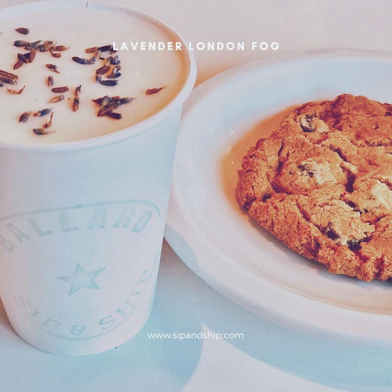 Coffee cup and cookie on white plate, with lavender petals on top of the drink.