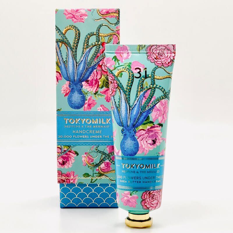 Floral turquoise and pink hand cream tube and matching box on a white background