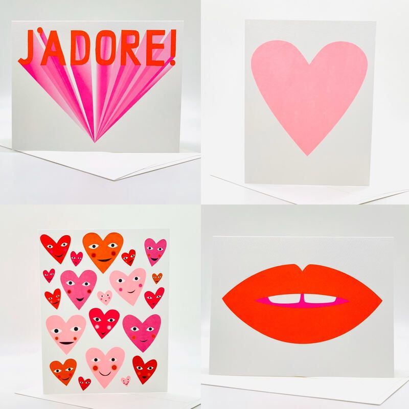 Collage of pink Valentine hearts and lips, including a card labeled “J’ADORE!”