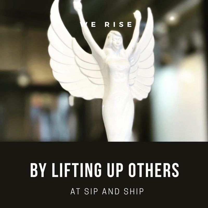 White angel statue with outstretched wings and text: “We rise by lifting up others.”