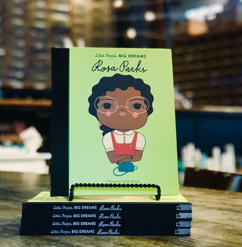 Stack of “Little People, BIG DREAMS” books featuring Rosa Parks on a table.