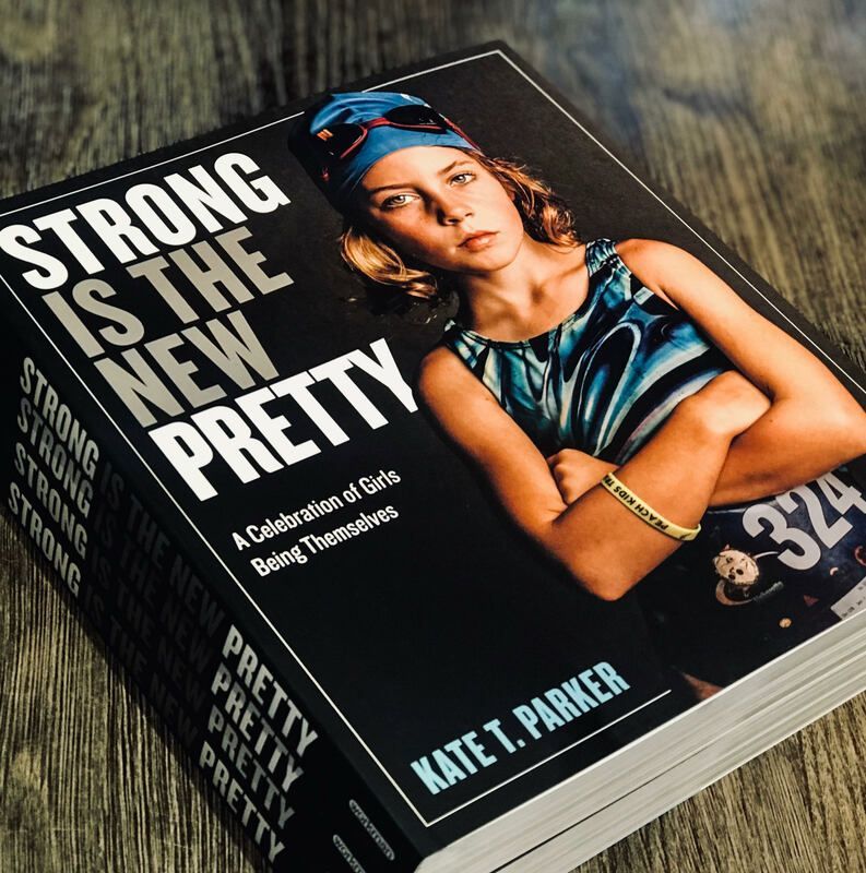 Book cover titled “Strong Is the New Pretty” by Kate T. Parker, with a woman in a blue headwrap and jacket.