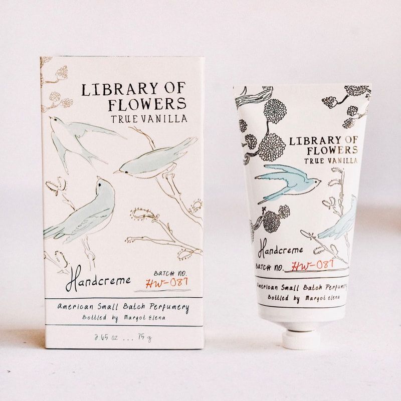 Hand cream box and tube labeled “Library of Flowers True Vanilla” with floral illustrations