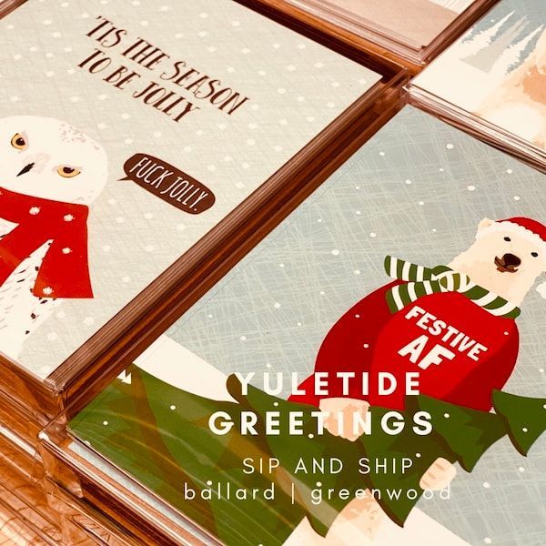 Festive holiday greeting cards with illustrated snowmen and seasonal text on a wooden table