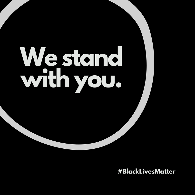 Black circle with white text: “We stand with you.” and #BlackLivesMatter.