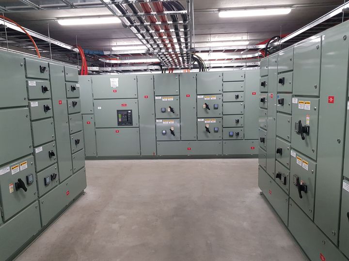 A large room filled with lots of electrical boxes.
