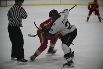Henderson Warriors player takes a face-off