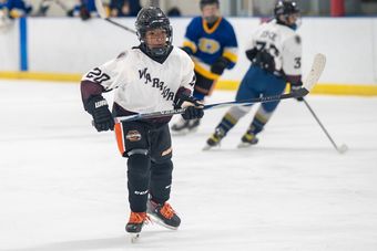 Young Henderson Warriors skater in a youth game