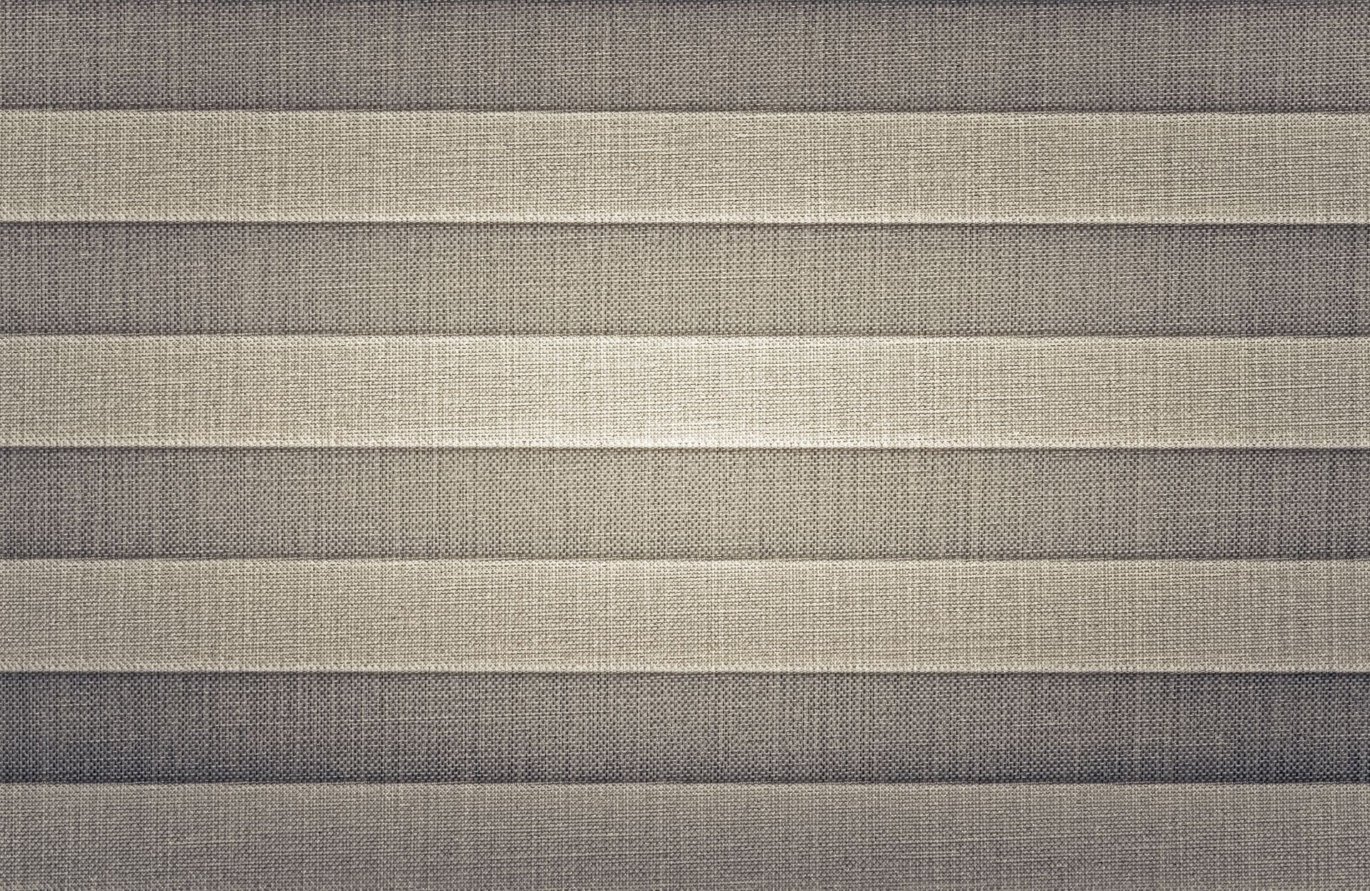 Close-up of beige and gray striped woven fabric texture Close-up of beige and gray striped woven fabric texture